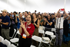 Crowd smiling and clapping